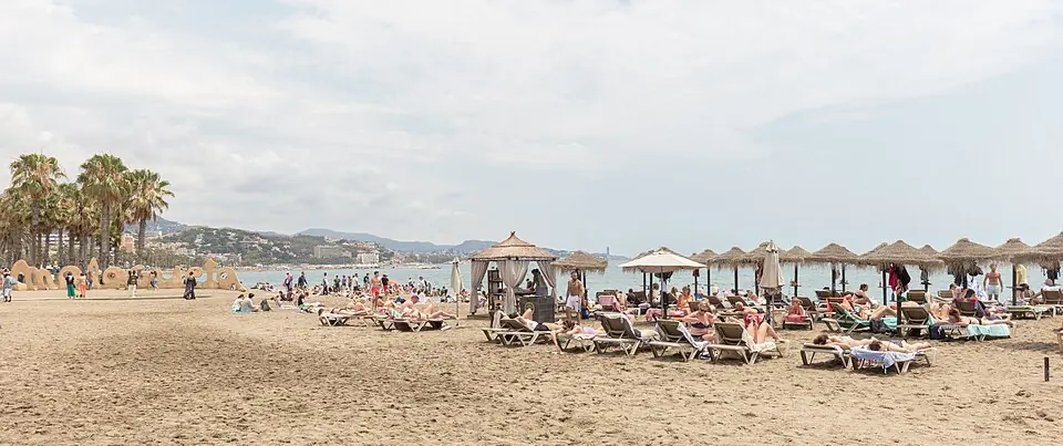 La Malagueta, Málaga city's urban beach, with its palm-lined promenade.